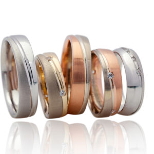 Various White, Yellow and Rose Gold Men’s Wedding Bands with differing finishes including sandblasting, brush and polished finishes.